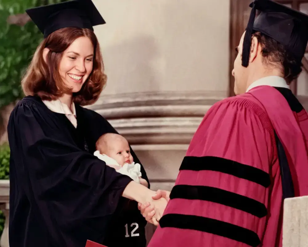 Doris at Harvard Law graduation with her newborn